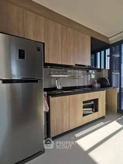 Modern kitchen with sleek cabinetry and stainless steel appliances