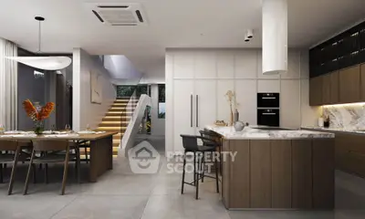 Luxurious modern kitchen with open layout and elegant dining area, featuring sleek cabinetry and stylish lighting.