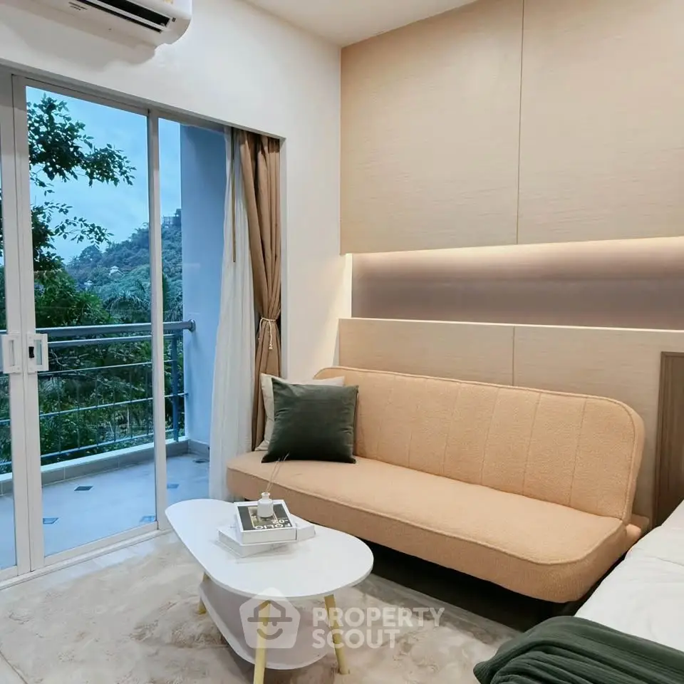 Modern living room with cozy sofa and balcony view