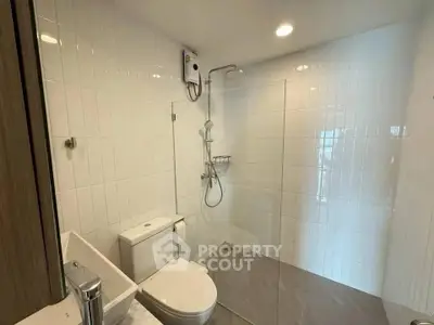 Modern bathroom with sleek shower and white tile design
