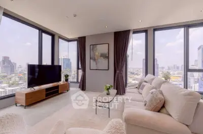 Luxurious corner unit living room with panoramic city views and modern decor.