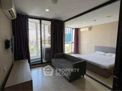 Modern studio apartment with balcony and stylish interior design