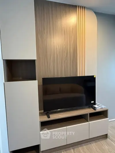 Modern living room with sleek TV unit and stylish wood paneling