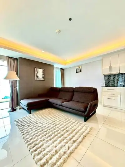 Spacious living room with modern decor and cozy sectional sofa