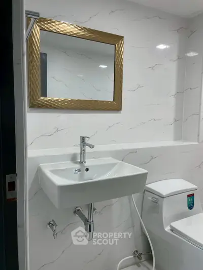 Modern bathroom with elegant mirror and sleek fixtures