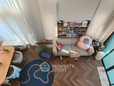 Stylish modern living room with high ceiling and cozy decor