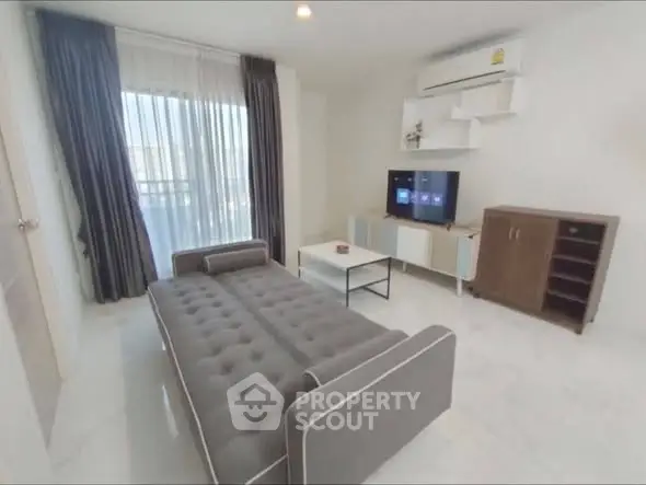 Modern living room with stylish sofa and entertainment center