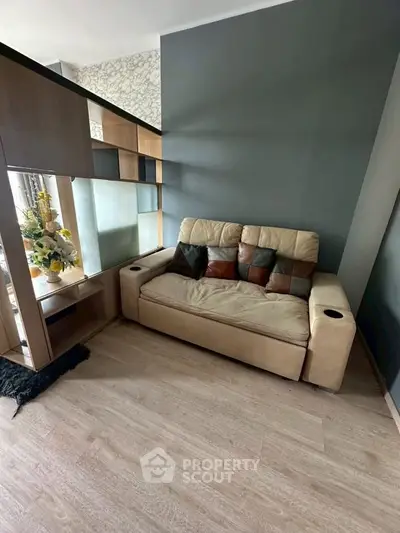 Modern living room with stylish sofa and decorative shelving unit