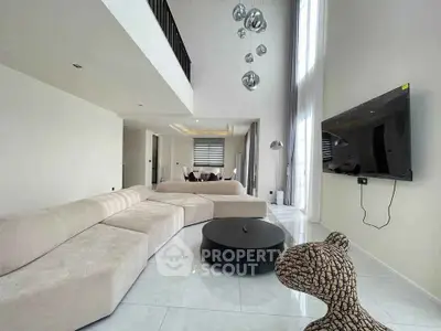 Luxurious modern living room with high ceilings and elegant decor