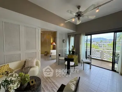 Spacious living room with elegant decor and large balcony overlooking scenic views.