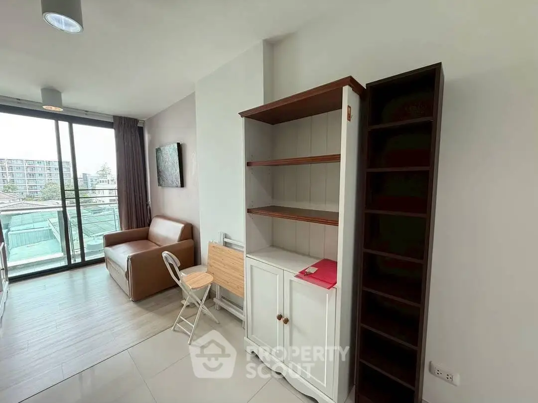 Modern living room with balcony view and stylish furniture