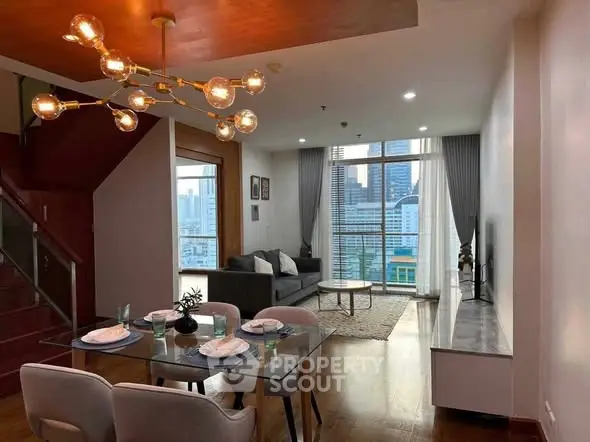 Modern living room with city view, stylish lighting, and elegant dining area in a high-rise apartment.