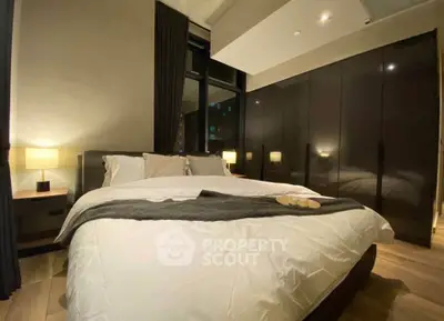 Luxurious modern bedroom with elegant lighting and sleek wardrobe design.
