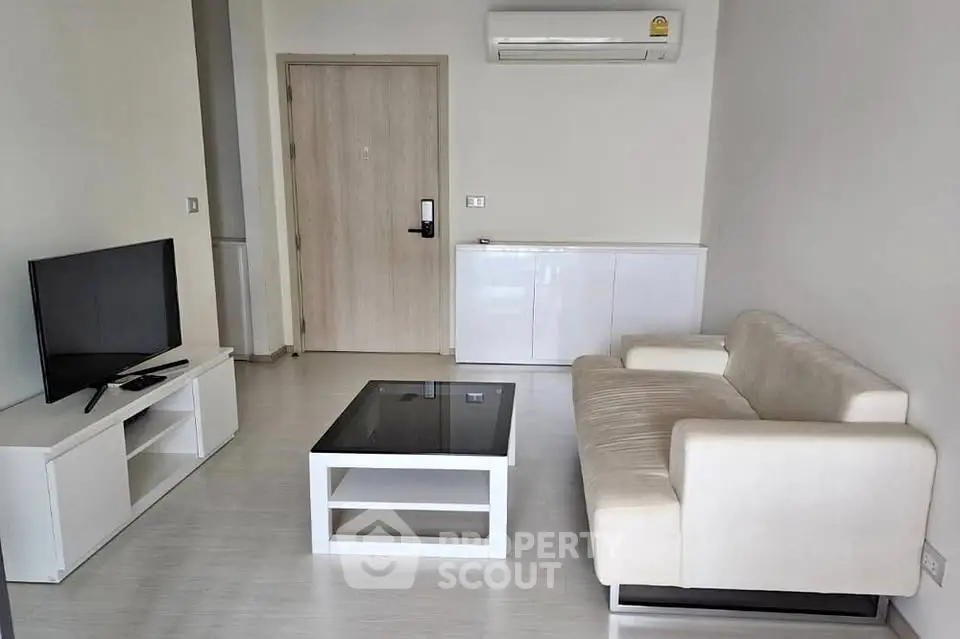 Modern living room with sleek furniture and air conditioning