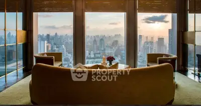 Luxurious living room with panoramic city skyline view, elegant seating, and floor-to-ceiling windows.