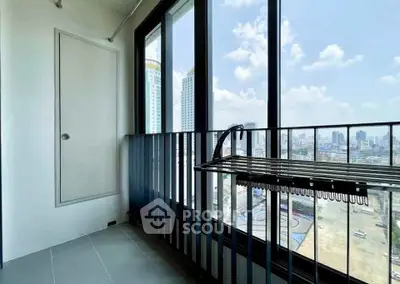 Modern balcony with stunning city view and ample natural light, perfect for relaxation and enjoying the skyline.