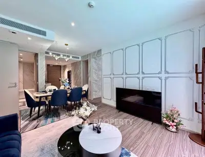 Luxurious modern living room with elegant dining area, featuring stylish decor and ample natural light.