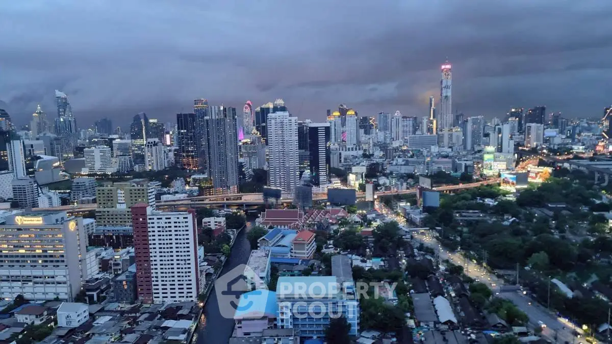 Stunning cityscape view showcasing a vibrant skyline with illuminated skyscrapers and bustling streets at dusk.