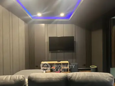 Modern home theater room with ambient lighting and sleek design