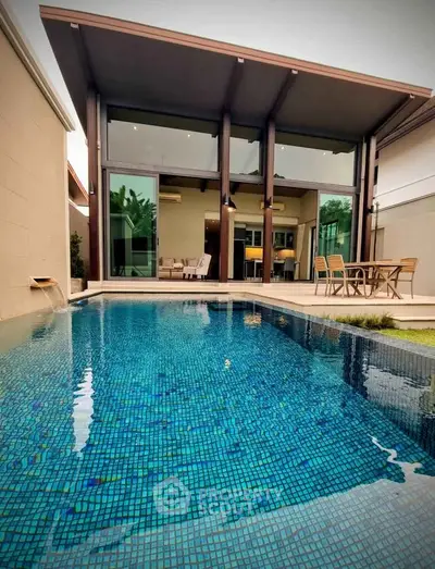 Luxurious modern villa with private pool and spacious patio area