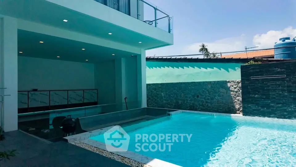 Luxurious modern home with private pool and sleek architectural design.