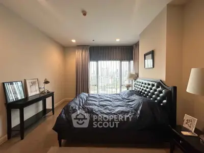 Luxurious bedroom with elegant decor and city view, featuring a plush bed and stylish furnishings.