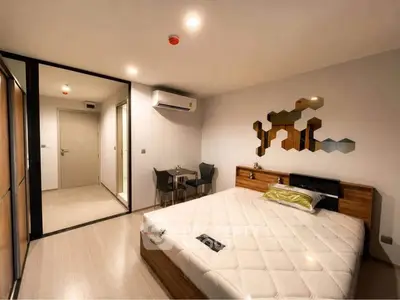 Modern bedroom with stylish decor and spacious layout in a contemporary apartment.