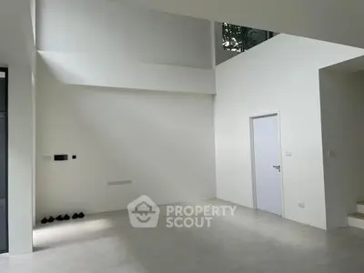 Spacious modern interior with high ceilings and minimalist design