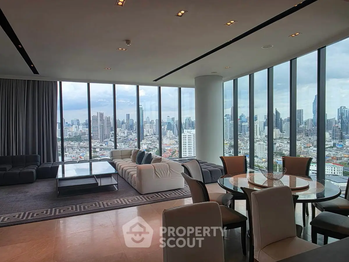 Luxurious corner unit living room with panoramic city views and elegant furnishings.