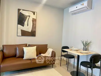 Modern living room with brown leather sofa and dining area