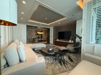 Luxurious modern living room with elegant decor and spacious seating area.