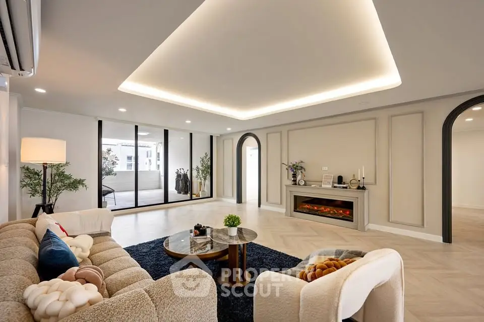 Luxurious living room with modern decor and large windows offering ample natural light.