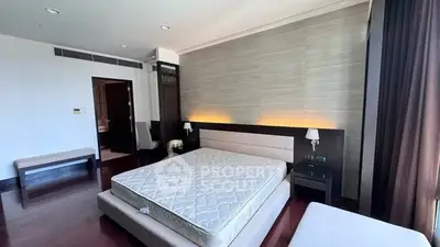 Spacious modern bedroom with elegant design and natural lighting