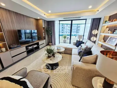 Luxurious modern living room with elegant decor and large windows offering city views.