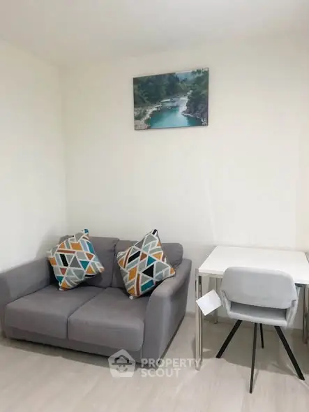 Cozy living room with modern sofa and stylish decor in a bright apartment.