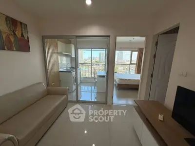 Modern apartment interior with open layout and city view from balcony.