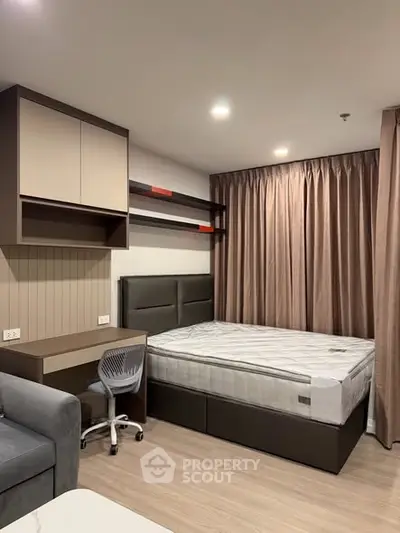 Modern bedroom with stylish furniture and cozy ambiance, perfect for urban living.