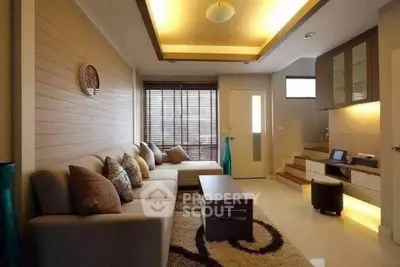 Stylish modern living room with cozy seating and elegant lighting