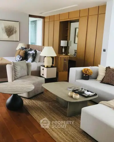 Luxurious open-plan living room with elegant decor and cozy seating area