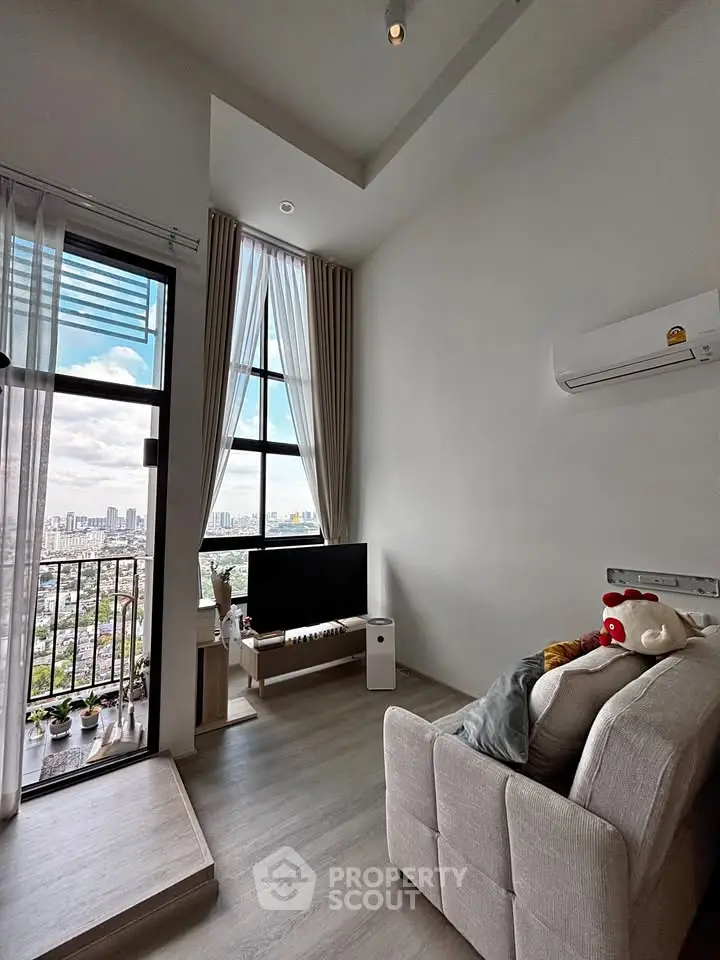 Modern living room with high ceiling and city view balcony