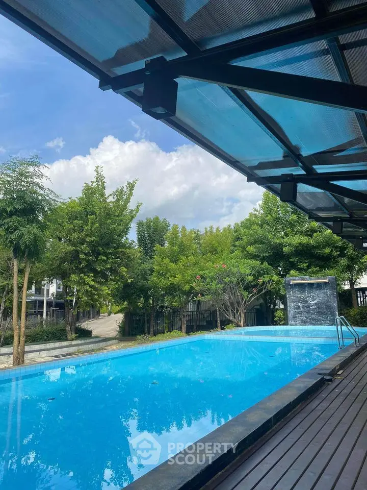 Stunning outdoor pool area with lush greenery and modern design