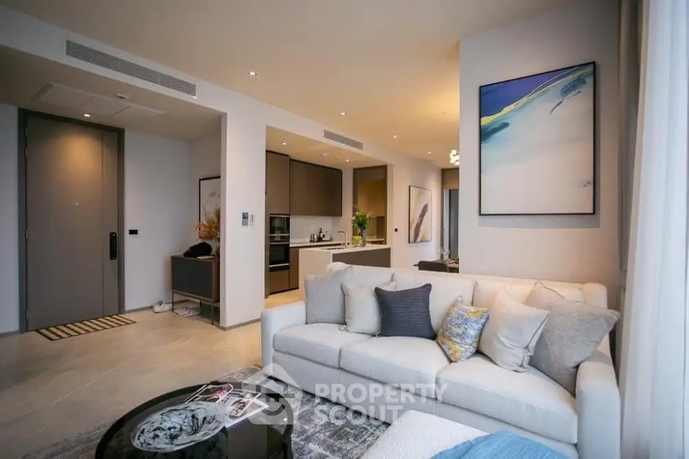 Modern living room with open kitchen and stylish decor