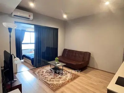 Modern living room with sleek design and cozy ambiance, featuring a brown sofa and stylish decor.