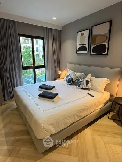 Modern bedroom with stylish decor and large window view