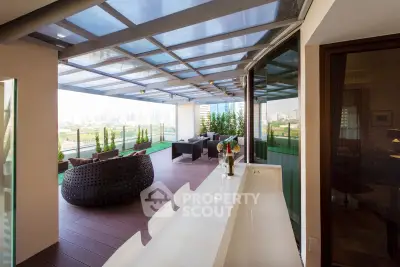 Luxurious modern balcony with stunning city view and stylish outdoor seating