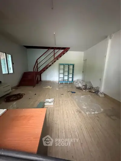 Spacious interior with staircase and potential for customization
