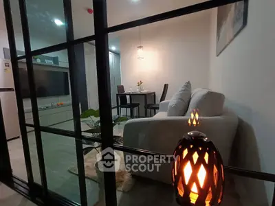 Modern living room with cozy sofa and dining area in open layout apartment