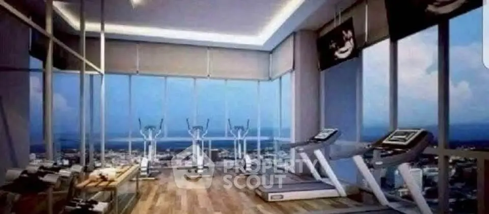 Luxurious high-rise gym with panoramic city views and modern fitness equipment.