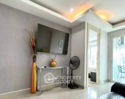 Modern living room with wall-mounted TV and stylish decor