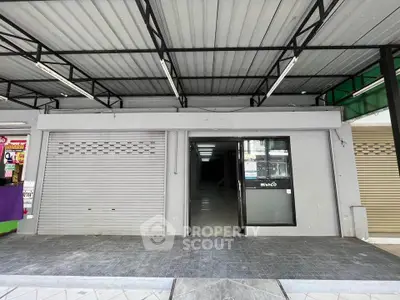 Commercial property with roller shutter and glass door entrance